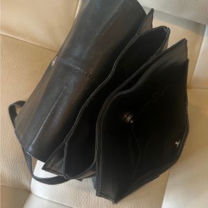 Radley Backpack in black leather with adjustable straps.